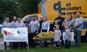 All Comfort Services in front of their van at Heat U.P. Wisconsin event