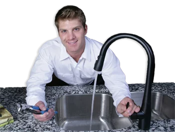 Plumber fixing a kitchen sink