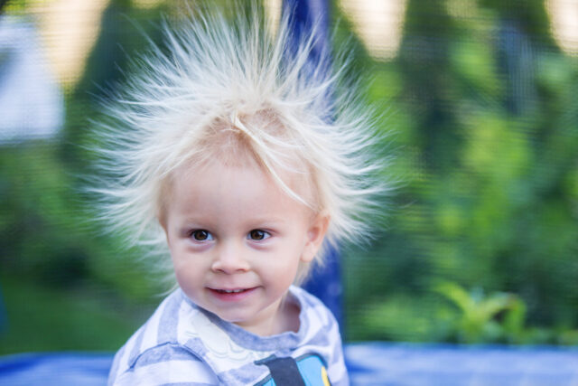 Cute little boy with static electricy hair