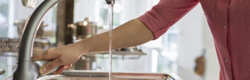 Homeowner using kitchen sink