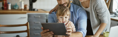Family looking over electric bills online