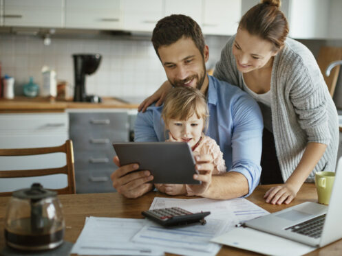 Family looking over electric bills online